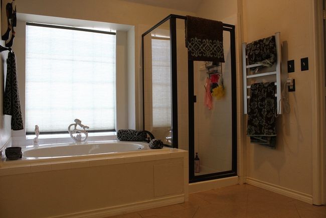 Full bathroom with a bath, a stall shower, and tile patterned floors | Image 7
