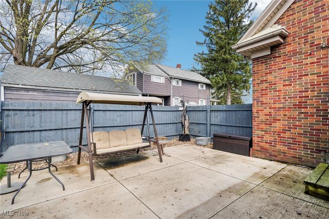 View of patio with a fenced backyard | Image 28