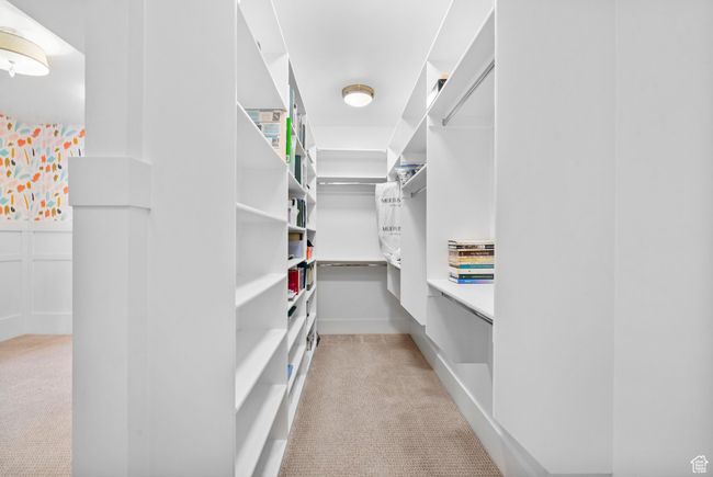 Spacious closet with light colored carpet | Image 73