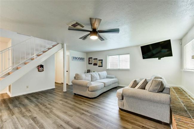 The spacious gathering room offers endless possibilities—whether you envision a cozy retreat or a vibrant entertainment space, it's yours to define and design. | Image 27