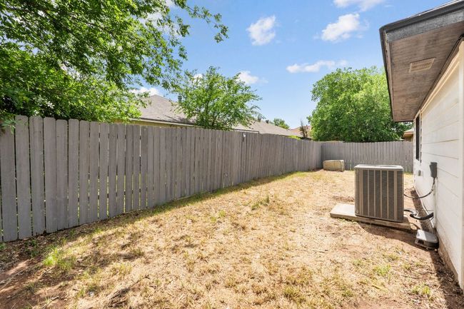 View of yard featuring central air condition unit and a fenced backyard | Image 31