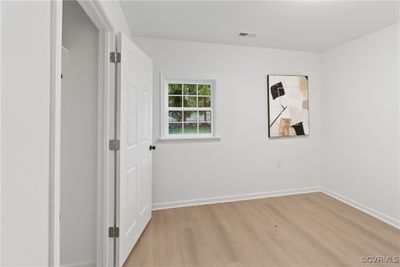 Unfurnished room with light hardwood / wood-style floors | Image 2