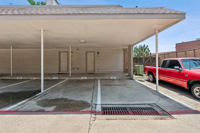 Covered parking lot with fence | Image 22