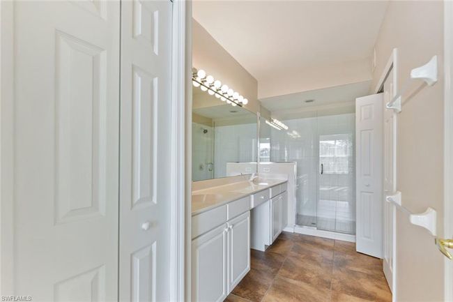 Bathroom featuring double vanity, a sink, and a stall shower | Image 24