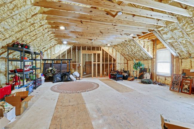 Insulated storage above the 3.5 car garage- can be finished off | Image 53
