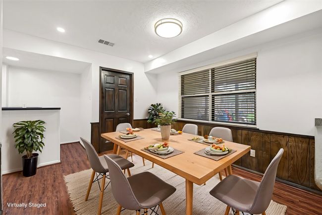 Virtual Staged: View of the formal dining and entrance to the wet bar. | Image 16