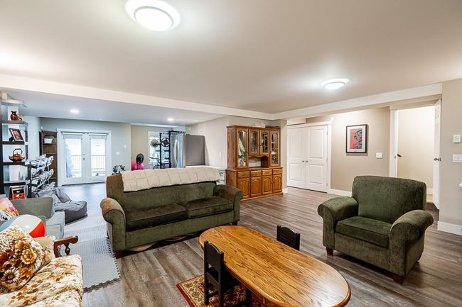 Living area featuring wood finished floors and baseboards | Image 27
