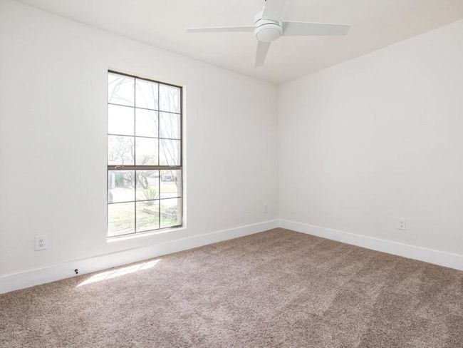 Empty room featuring baseboards, carpet floors, and a ceiling fan | Image 19