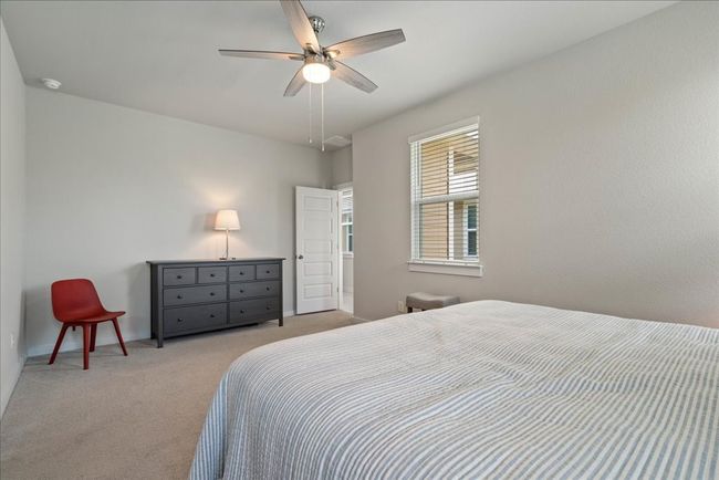 Carpeted bedroom with baseboards and ceiling fan | Image 14