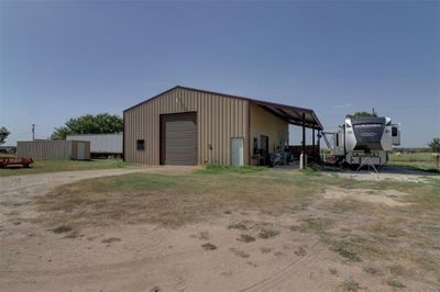 View of outdoor structure featuring a garage | Image 1