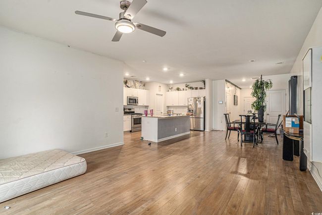 Living area with hardwood / wood-style floors, ceiling fan, recessed lighting, and baseboards | Image 10