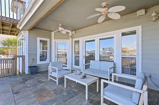 Large covered seating area with relaxing canal views. | Image 6