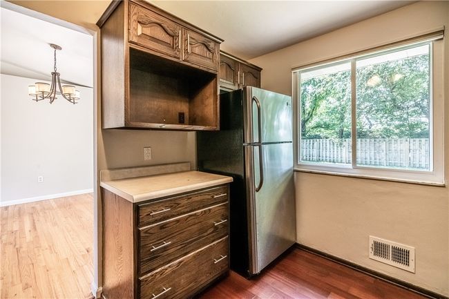 The upper cabinet is the perfect spot for a microwave. | Image 9