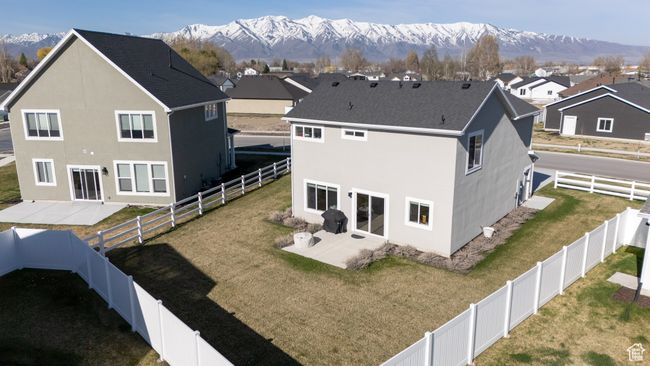 Back of house featuring a patio area, a fenced backyard, and stucco siding | Image 28