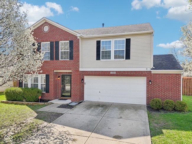 view of front of house featuring brick siding, driveway, a garage, and a shingled roof | Image 71