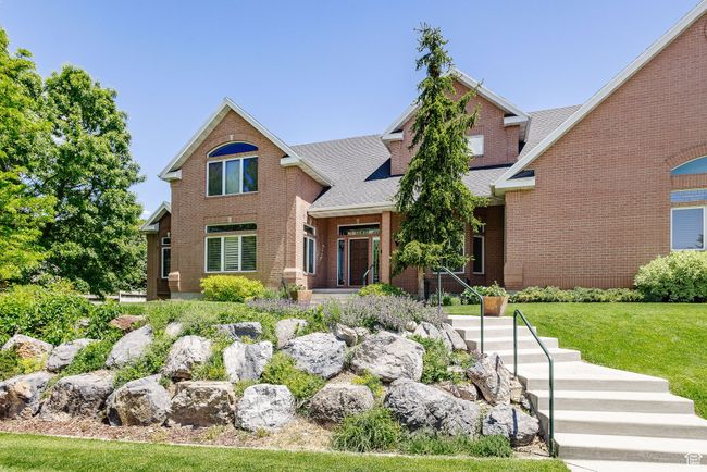 View of front of house with brick siding, a shingled roof, and a front yard | Image 72
