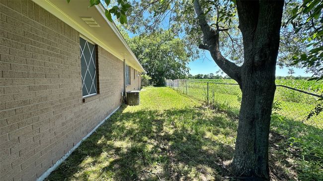 Spacious lot with room for outdoors toys and gardening | Image 32