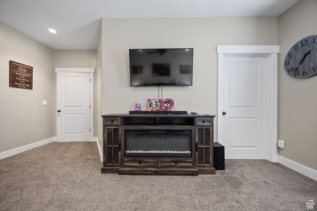 Carpeted living room featuring baseboards | Image 36