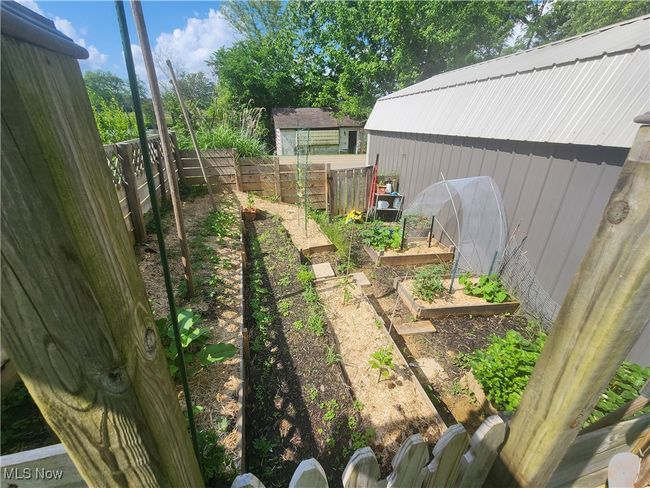 Fenced backyard featuring a garden | Image 31
