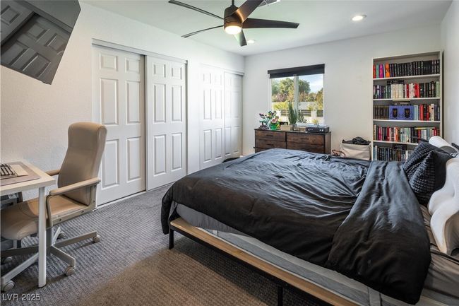 Carpeted bedroom featuring recessed lighting, two closets, and ceiling fan | Image 23