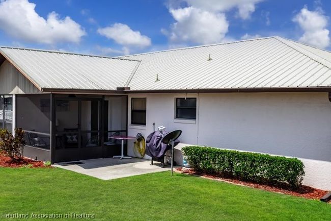 back of home w/extra slab for BBQ or store your golf cart | Image 24