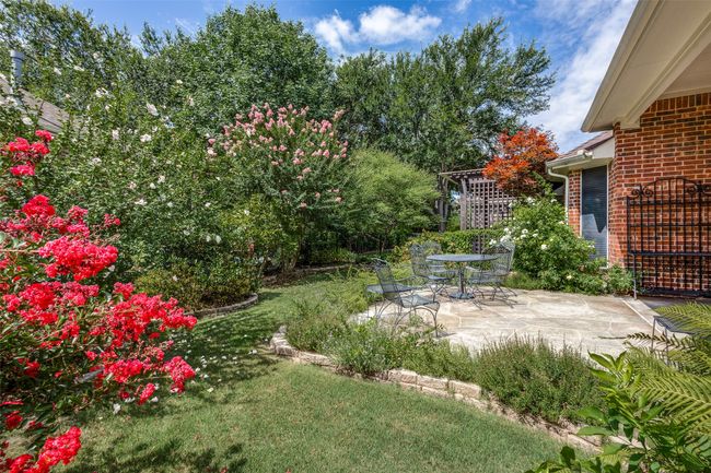 View of grassy yard with a patio | Image 24