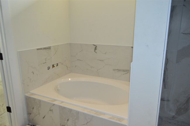 Full bathroom with a garden tub | Image 16