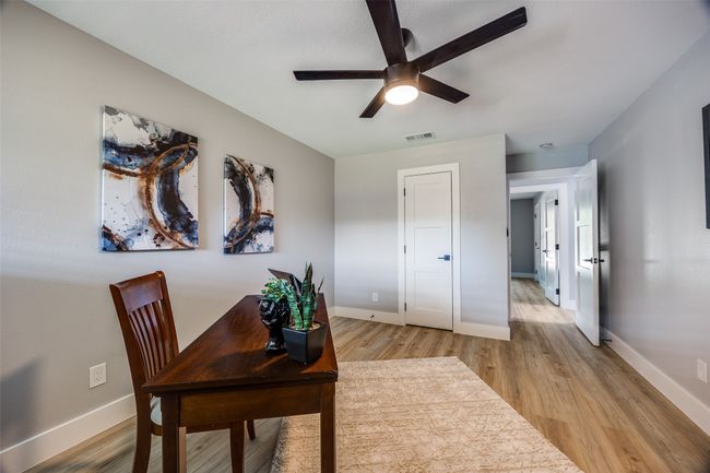 Office featuring a ceiling fan and light wood-style floors | Image 25