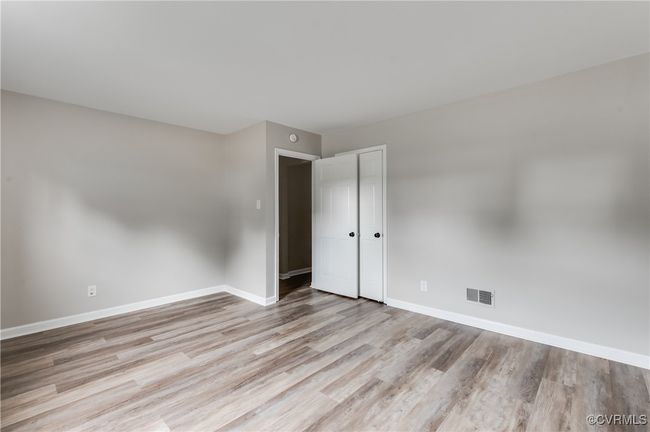 Empty room with light wood-style floors and baseboards | Image 20