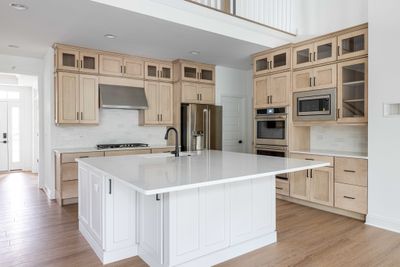 Your Kitchen offers double ovens, a walk in pantry, a gas cooktop and plenty of storage both on the walls and in the island! | Image 2