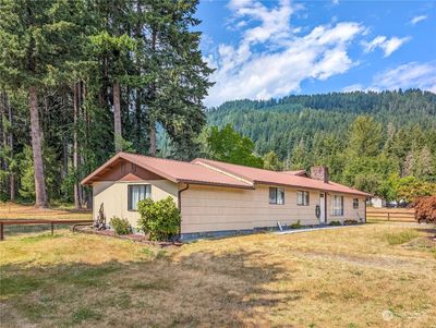 View of the front of the house and peeking at the back yard | Image 2