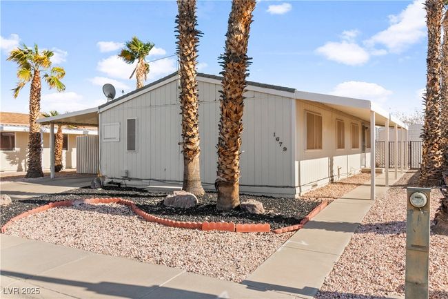 View of front of property featuring a carport and crawl space | Image 26