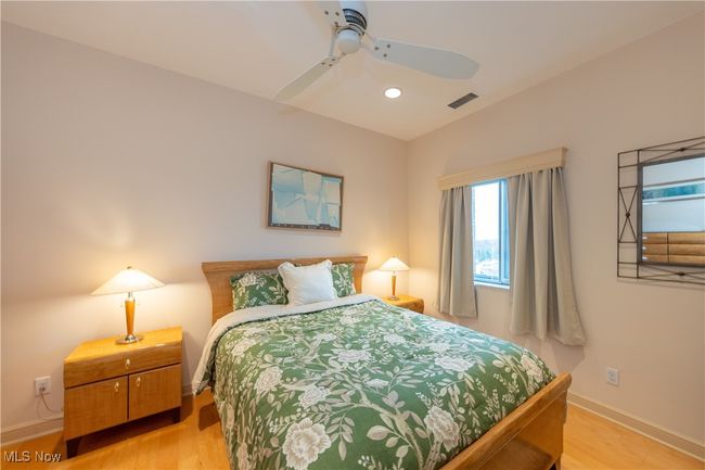 Guest Bedroom 2 featuring visible vents, recessed lighting, ceiling fan, baseboards, and light wood-type flooring | Image 42