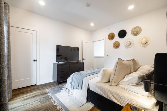 Bedroom featuring recessed lighting and wood finished floors | Image 20