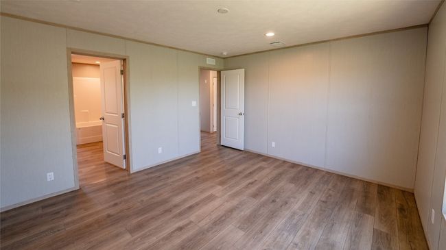 Spare room with crown molding, wood finished floors, and recessed lighting | Image 28