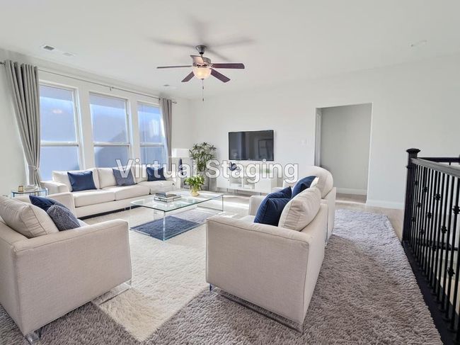 Living room featuring ceiling fan and baseboards | Image 37