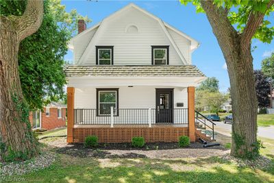 View of property featuring a porch | Image 1