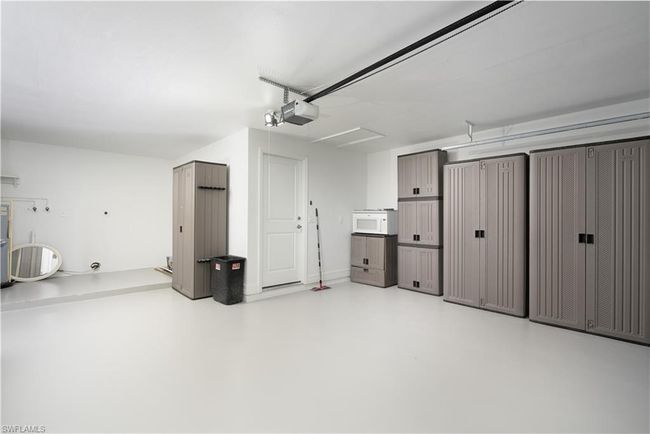 Garage featuring a garage door opener | Image 25
