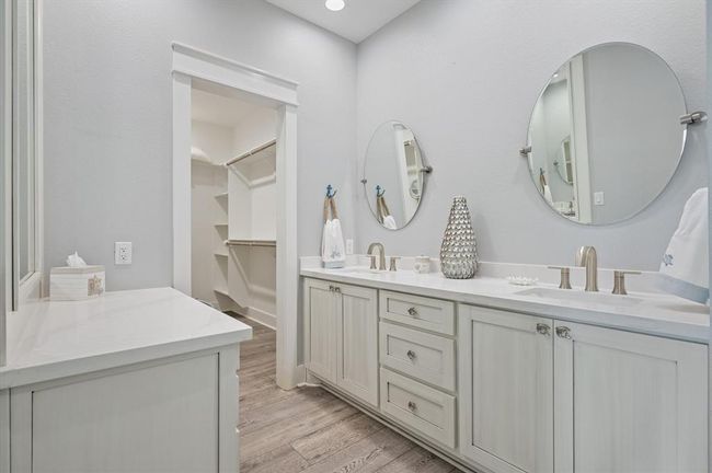 Double sinks and a large closet in this primary bathroom | Image 32