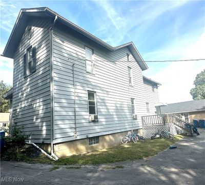 View of side of property featuring a wooden deck | Image 2