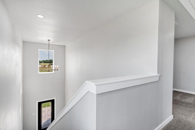 Hall featuring an upstairs landing, carpet flooring, plenty of natural light, baseboards, and recessed lighting | Image 21