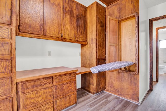 Fold out ironing board. | Image 20