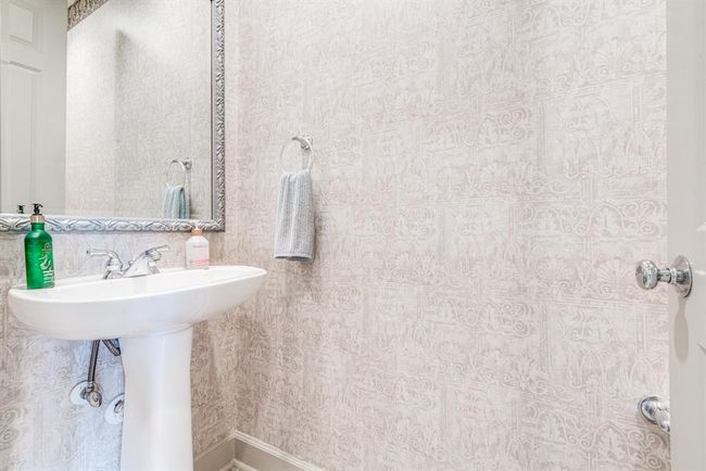 Convenient powder room between garage and kitchen area. Convenient yet tucked away. | Image 31