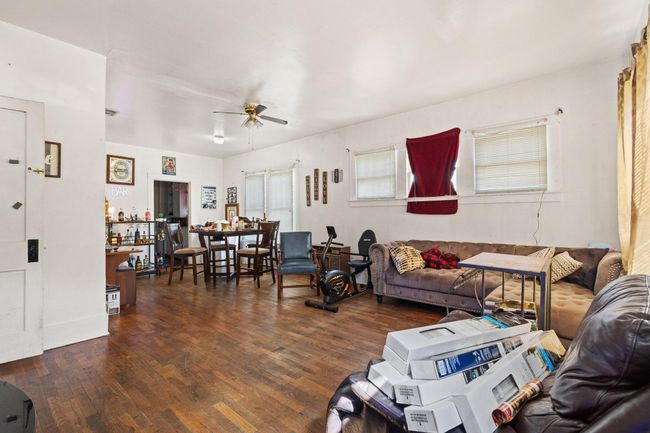 Living room featuring a ceiling fan and wood finished floors | Image 4