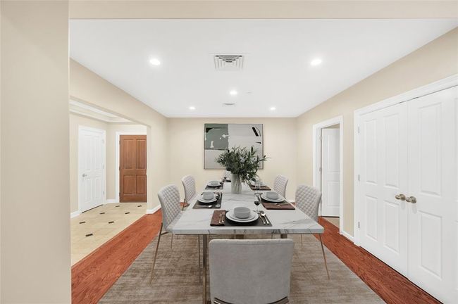 The Dining Room is approximately 15'x13'* and could easily accommodate a large dining table and buffet. It is large enough to create a Study in addition to Dining if desired. Double closed doors is HVAC closet and open door leads to Kitchen. *Buyer to verify dimensions. PHOTO VIRTUALLY STAGED. | Image 16