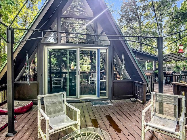 Front deck sliders lead to the living room and beyond. Notice the light streaming into the house. | Image 6