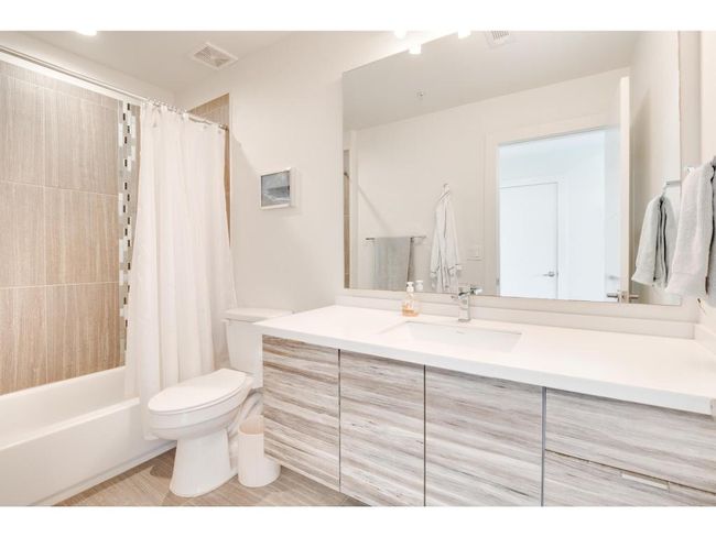 Bathroom with vanity and shower / bath combination with curtain | Image 15