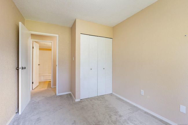 Unfurnished bedroom featuring carpet flooring, a closet, and baseboards | Image 20