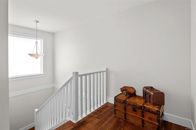 Staircase with wood finished floors and baseboards | Image 31