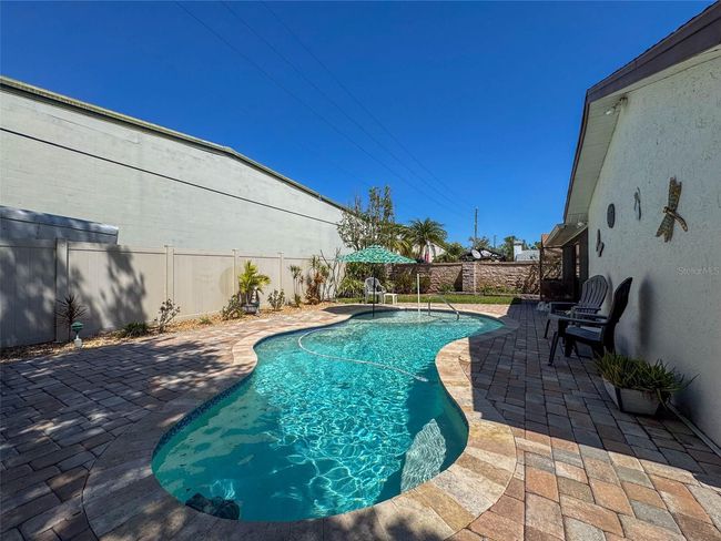 pool surrounded with pavers | Image 47
